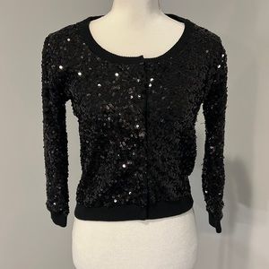 Black sequins sweater.